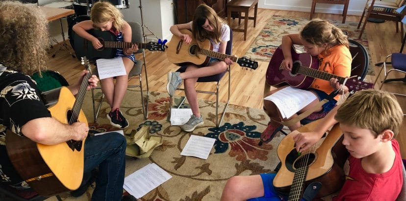 Students practicing guitar