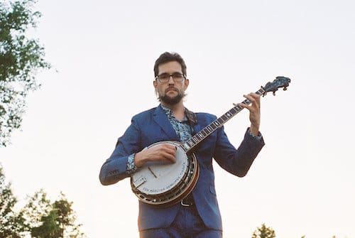 Joe Troop holding a banjo.