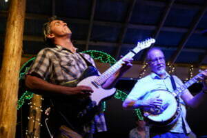 Andy playing guitar at Rivanna Roots